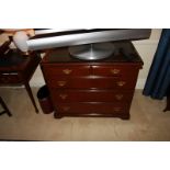 A Georgian style mahogany chest of drawers with three full and two half drawers on bracket plinth