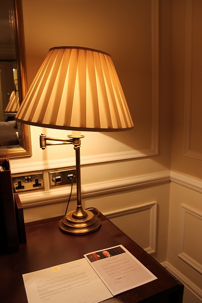 A brass swivel arm table lamp