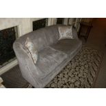 A modern curved upholstered grey mottled two seater sofa 1600mm x 650mm