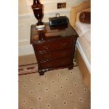 A pair of mahogany bedside cabinet chests in the Georgian style three drawers below, of dovetail