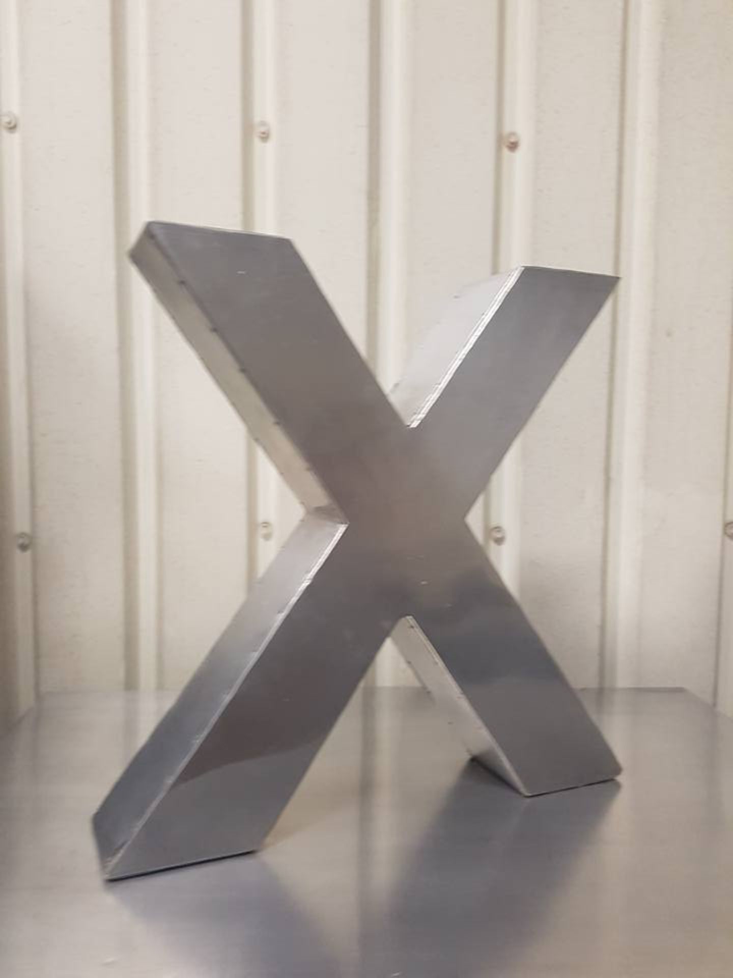 Letter X Aero handcrafted in a slightly distressed aluminium finish