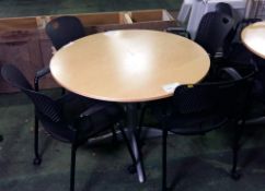 Round tables with 4 mobile Herman Millar stackable chairs