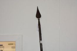 A polearm in 18th century style, with teardrop shaped blade on a studded shaft. Length overall