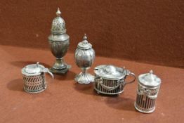 A group of silver condiments, various dates and makers, comprising a late Victorian mustard and