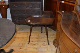 A 19th century mahogany trug table, with bowed shelf, raised on turned splayed legs terminating in