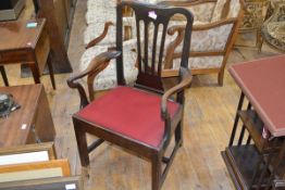 A George III provincial mahogany open armchair, early 19th century, with pierced splat, drop-in