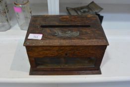 A country house table top oak letter box, with glazed panel (lacking key)