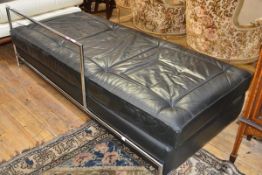 After Eileen Gray (1878-1976), a chrome-upholstered leather-upholstered day bed.