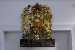 A Queen Elizabeth II painted cast-metal Royal Warrant Holder's coat of arms, with the Scottish
