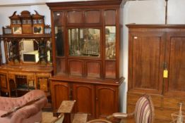An unusual late 19th century mahogany bookcase/display cabinet, the upper section with an