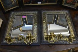 A pair of late Victorian oak and brass girandole mirrors in the Arts & Crafts taste, each with