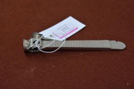 A Continental silver cigar cutter, 830 standard, with engraved geometric decoration. Length 14.5cm