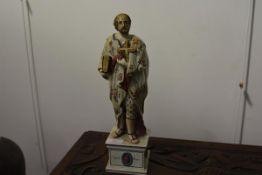A glazed earthenware figure of Saint Peter in the manner of Ralph Wood, modelled standing with