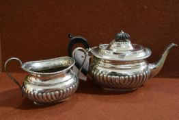 A late Victorian silver partial bachelor's two piece tea service, Samuel Walton Smith, London