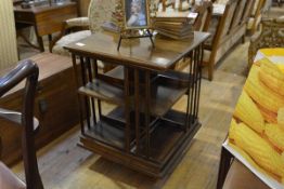 An early 20th century rosewood revolving bookcase, square, of characteristic form. 74cm by 58cm