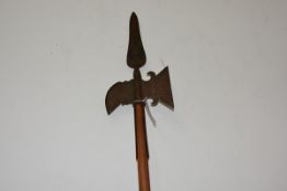 A Continental halberd in 17th century style, the leaf-shaped spike cast to each side with a crest,