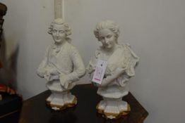 A pair of Continental bisque porcelain busts of a lady and gentleman in 18th century costume, 20th