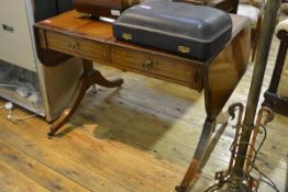 A Regency rosewood-crossbanded and string-inlaid mahogany sofa table, of characteristic form, fitted