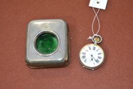 An Edwardian silver watch stand, London 1905, with leather easel back enclosing a white metal pocket