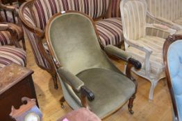 A William IV rosewood framed open armchair, the spoon back above a stuffed over seat flanked by