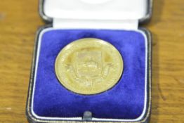 A 9ct gold scholastic medal, Dumbarton Burgh Academy, Dux in Mathematics, engraved to Robert C.