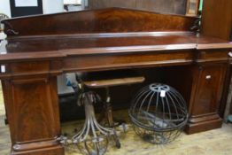 A mid-Victorian mahogany pedestal sideboard, with pedimented backboard above a moulded top over an