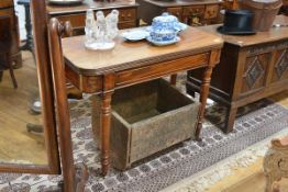 A George IV mahogany foldover tea table, the D-end top above a fielded panel frieze, on turned legs.