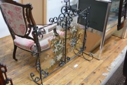 An early 20th century Scottish wrought iron and painted glass firescreen, J. Bennet, Arncroach,