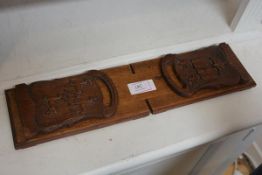 Jesus College, Oxford, a late 19th/early 20th century oak book slide, one end carved with the