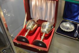 A pair of cased silver goblets, Birmingham 1972, each with tapering bucket bowl and gilt interior,