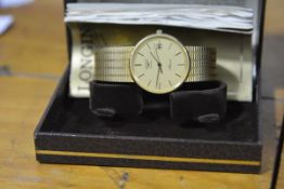 A Longines Presence 9ct gold wristwatch, quartz movement, the gilt dial with baton numerals