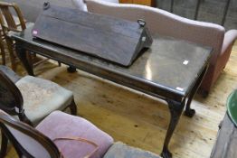 A walnut side table, possibly Whytock and Reid, in the George II style, the quarter-veneered moulded