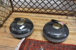 A pair of granite curling stones, with hardwood handles issuing from a brass plate inscribed "