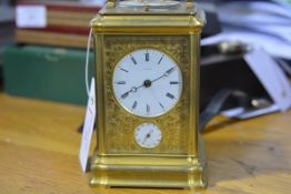 A good mid-19th century French gilt-brass repeating carriage clock, the white enamel dial and