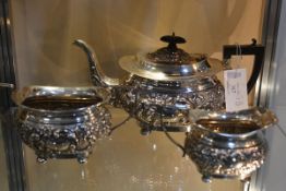 An Edwardian silver three piece tea service, Joseph Gloster, Birmingham 1904, in the Rococo