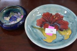 A small Moorcroft bowl, Freesia pattern against a blue ground, impressed marks; together with a