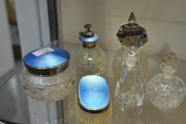 A group of early 20th century silver-mounted glass dressing table jars and accessories comprising: