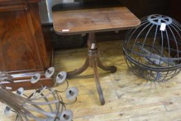 A George III mahogany tripod table, the square top with rounded corners, above a baluster standard