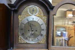 A late George III oak longcase clock, the silvered chapter ring with Roman numerals enclosing