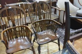 An oak and elm Windsor armchair in 19th century style, with hoop back, dished seat and turned legs