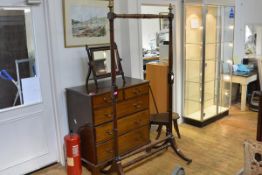 A Regency mahogany cheval mirror frame, with brass urn-topped uprights, the downswept trestle legs