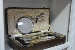 A George V cased six piece silver-backed dressing table set, Daniel Manufacturing Co., Birmingham