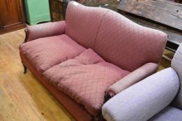 An early 20th century mahogany framed two seater sofa, with serpentine back, loose-cushioned seat