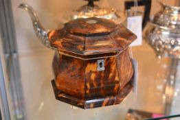 An early 19th century tortoiseshell-veneered, ivory banded and silver (unmarked) mounted tea