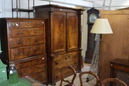 A Victorian mahogany linen press, with moulded cornice above a pair of panelled doors enclosing