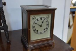 An early 20th century mahogany cased bracket clock, the silver dial with Roman numerals and two