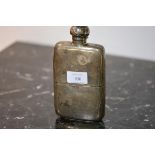 A George V silver hip flask, London 1910, shaped for the hand, with detachable cup and twist top,