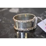 A silver napkin ring, J.B. Chatterley & Sons, Birmingham 1976, oval, chased with twin Celtic