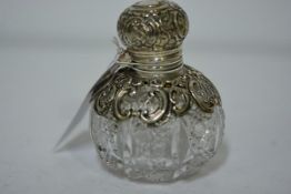 A late Victorian silver-mounted cut-glass scent bottle, Birmingham 1894, of globular form, the