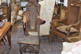 A Charles II walnut side chair, with scroll carved crest rail above a canework panel back flanked by